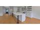 Spacious open kitchen features stainless steel appliances, large island, and modern finishes throughout at 553 Somersby Dr, Dallas, GA 30157