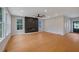 Spacious living room features hardwood floors, modern fireplace, and large windows at 553 Somersby Dr, Dallas, GA 30157