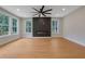 Spacious living room features hardwood floors, modern fireplace, and large windows at 553 Somersby Dr, Dallas, GA 30157