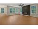 Expansive living room features hardwood floors, a modern fireplace, and large windows at 553 Somersby Dr, Dallas, GA 30157