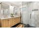 Modern bathroom with double vanity, stylish mirrors, and walk-in glass shower at 1144 Edie Se Ave, Atlanta, GA 30312