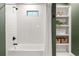 Bathroom showcases a tiled tub/shower and shelving at 1144 Edie Se Ave, Atlanta, GA 30312