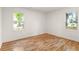 Bright bedroom with hardwood floors and two large windows offering natural light at 1144 Edie Se Ave, Atlanta, GA 30312