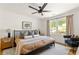 Bright bedroom with a ceiling fan, natural light, and modern furnishings at 1144 Edie Se Ave, Atlanta, GA 30312