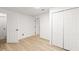 Finished basement area with hardwood style floors and many closets at 1420 Midland Way, Lawrenceville, GA 30043