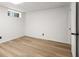 Finished basement area with hardwood style floors and a small window at 1420 Midland Way, Lawrenceville, GA 30043