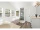 Bright bathroom featuring a tub, shower, vanity, and windows at 1420 Midland Way, Lawrenceville, GA 30043