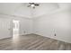 A modern, airy bedroom featuring recessed lighting and hardwood-style floors at 1420 Midland Way, Lawrenceville, GA 30043