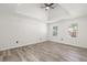 Bright bedroom featuring modern ceiling fan, recessed lighting, and hardwood-style floors at 1420 Midland Way, Lawrenceville, GA 30043