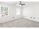 A bright bedroom featuring neutral walls and flooring with plenty of natural light at 1420 Midland Way, Lawrenceville, GA 30043