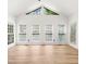 Bright bonus room featuring many windows and wood floors at 1420 Midland Way, Lawrenceville, GA 30043