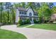 A charming two-story home with a driveway and a beautiful front lawn at 1420 Midland Way, Lawrenceville, GA 30043
