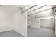 Spacious garage area with concrete floors, neutral white paint, and overhead storage at 1420 Midland Way, Lawrenceville, GA 30043