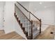Hallway with hardwood flooring, carpeted staircase, white walls with access to a dining room at 1420 Midland Way, Lawrenceville, GA 30043