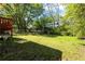 Lush green backyard offers a peaceful outdoor space and ample room to relax at 2383 Baker Nw Rd, Atlanta, GA 30318