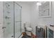 Bathroom featuring a standing shower, toilet, vanity, and lighting at 2383 Baker Nw Rd, Atlanta, GA 30318