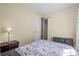 Comfortable bedroom with closet and bedside table with lamp at 2383 Baker Nw Rd, Atlanta, GA 30318