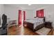 Bedroom with hardwood floors, ample natural light, and closet space at 2383 Baker Nw Rd, Atlanta, GA 30318