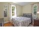 Bright bedroom with natural light, hardwood floors and floral-patterned curtains at 2383 Baker Nw Rd, Atlanta, GA 30318