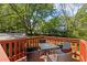 Outdoor deck with patio furniture set for enjoying the green backyard and sunny days at 2383 Baker Nw Rd, Atlanta, GA 30318