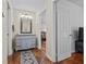 Open hallway features hardwood floors, custom paint, and access to other rooms at 2383 Baker Nw Rd, Atlanta, GA 30318