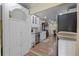 Charming kitchen featuring white cabinetry, stainless steel dishwasher and hardwood floors at 2383 Baker Nw Rd, Atlanta, GA 30318