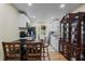 Well lit kitchen featuring white cabinets and modern appliances, flowing into laundry area at 2383 Baker Nw Rd, Atlanta, GA 30318