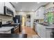 Modern kitchen with white cabinets, marble countertops, and stainless steel appliances at 2383 Baker Nw Rd, Atlanta, GA 30318