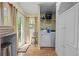 Practical laundry area with washer, dryer, and storage at 2383 Baker Nw Rd, Atlanta, GA 30318