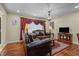 Cozy living room featuring hardwood floors, neutral walls, and an elegant chandelier at 2383 Baker Nw Rd, Atlanta, GA 30318