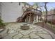 A sprawling backyard features a fire pit and stone patio along with a two-story deck at 4284 Windy Gap Nw Ct, Kennesaw, GA 30144