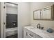 Well-lit bathroom featuring a marble vanity, modern sink, and walk-in shower, for a spa-like experience at 4284 Windy Gap Nw Ct, Kennesaw, GA 30144
