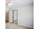 Bedroom with carpeted floors, ceiling fan and closet offering comfort and practicality at 4284 Windy Gap Nw Ct, Kennesaw, GA 30144