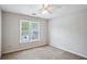Cozy bedroom with a ceiling fan and bright windows, offering natural light and comfort at 4284 Windy Gap Nw Ct, Kennesaw, GA 30144