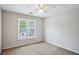 Cozy bedroom featuring two windows, a ceiling fan, and neutral tones, creating a serene atmosphere at 4284 Windy Gap Nw Ct, Kennesaw, GA 30144