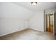 Neutral bedroom featuring a closet, an overhead light, and access to the upper floor hallway at 4284 Windy Gap Nw Ct, Kennesaw, GA 30144