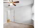 Bright bedroom with light carpet, large window, and ceiling fan, creating a tranquil retreat at 4284 Windy Gap Nw Ct, Kennesaw, GA 30144