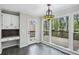 Eat-in area with access to wooden deck with view of a treed backyard at 4284 Windy Gap Nw Ct, Kennesaw, GA 30144