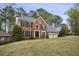 Charming two-story brick home with a two-car garage and a well-maintained lawn at 4284 Windy Gap Nw Ct, Kennesaw, GA 30144