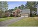 Charming brick two-story home with black shutters, a two-car garage, and an ample front yard at 4284 Windy Gap Nw Ct, Kennesaw, GA 30144