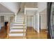 Inviting foyer with hardwood floors, staircase, and soaring ceilings creating a grand entrance at 4284 Windy Gap Nw Ct, Kennesaw, GA 30144