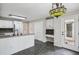Open concept kitchen features a built-in desk area and access to the deck at 4284 Windy Gap Nw Ct, Kennesaw, GA 30144