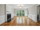 Bright and spacious living room with hardwood floors and a cozy fireplace at 4284 Windy Gap Nw Ct, Kennesaw, GA 30144