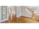 Open-concept living room with hardwood floors, and french doors with plenty of natural light at 4284 Windy Gap Nw Ct, Kennesaw, GA 30144