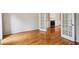 Gorgeous hardwood floors in a living room featuring French doors leading to other rooms at 4284 Windy Gap Nw Ct, Kennesaw, GA 30144