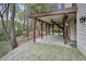 Spacious covered patio featuring an outdoor ceiling fan at 4284 Windy Gap Nw Ct, Kennesaw, GA 30144