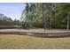Beautiful playground with slides and swings for Gathering fun and enjoyment set against a backdrop of mature trees at 4284 Windy Gap Nw Ct, Kennesaw, GA 30144