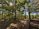 Backyard features a deck overlooking a large yard with trees and shade at 5130 English Dr, Cumming, GA 30041