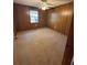Spacious bedroom features a lighted ceiling fan and a window for natural light at 5130 English Dr, Cumming, GA 30041