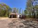 A well-maintained single-story home featuring a covered carport and a welcoming front porch at 5130 English Dr, Cumming, GA 30041